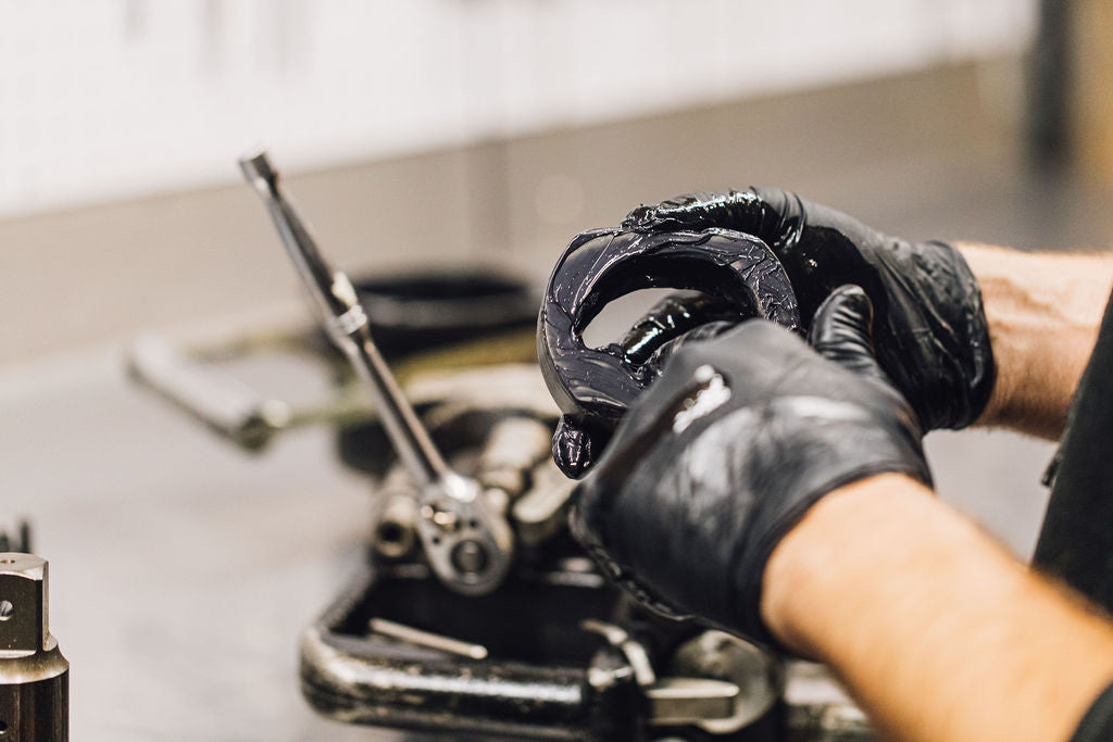 Technician servicing a rail tool in the Backtrack shop